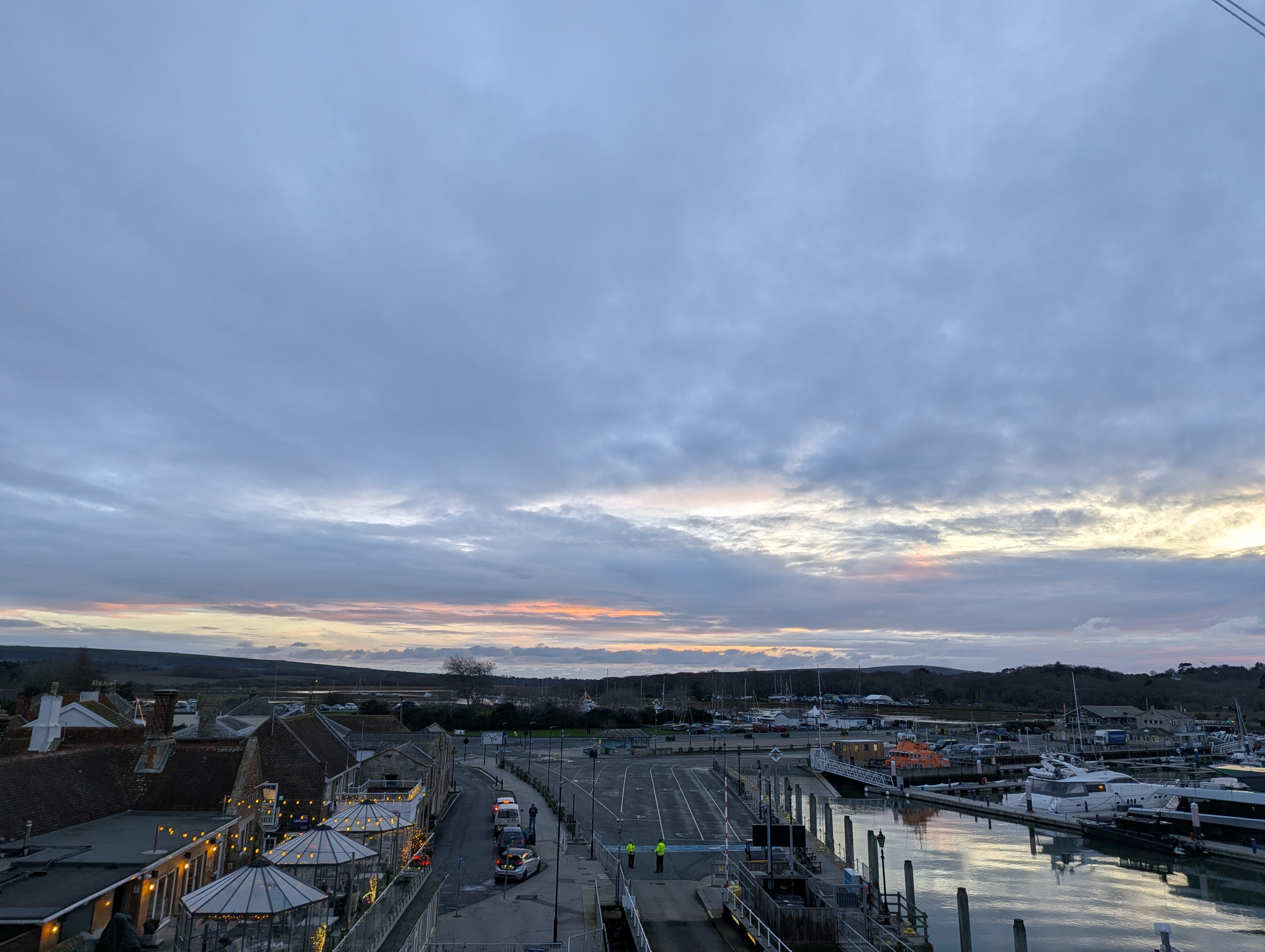 A view of the sunset and cars in Yarmouth from the ferry.